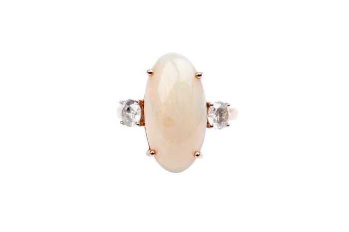 An Andamooka opal and diamond ring in 14 carat rose gold