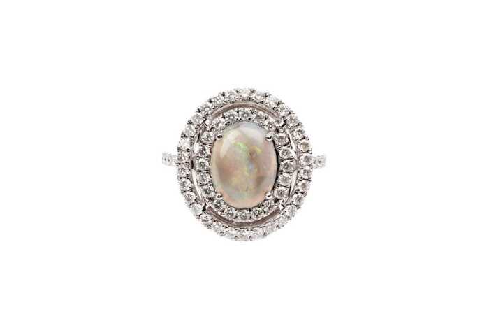 A Lightening ridge opal and diamond ring in 14 carat white gold