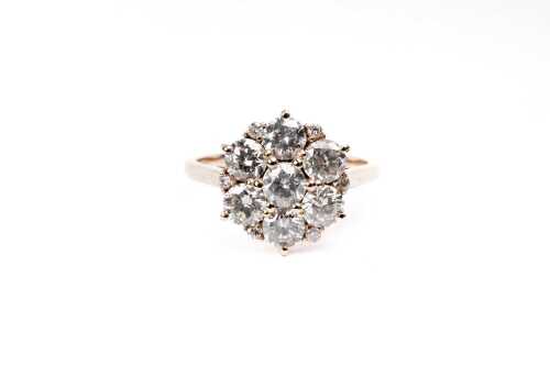A diamond ring in 14 carat yellow gold