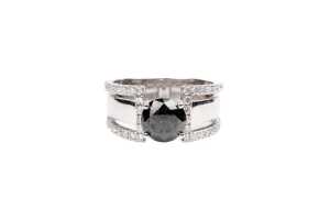 A black and white diamond ring in 14 carat white gold