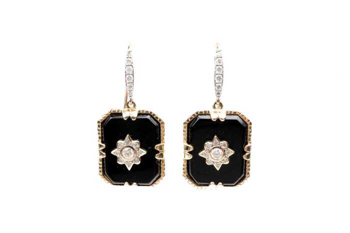 A pair of onyx and diamond earrings in 14 carat yellow gold