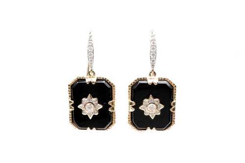 A pair of onyx and diamond earrings in 14 carat yellow gold