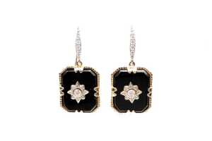 A pair of onyx and diamond earrings in 14 carat yellow gold