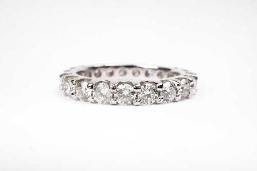 A fully set diamond band in 14 carat white gold