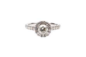 A diamond halo ring in 18 carat white gold