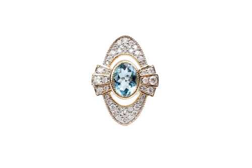 An aquamarine and diamond ring in 14 carat yellow gold
