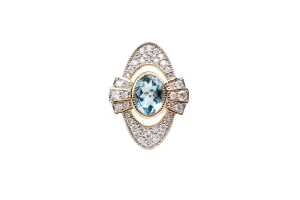 An aquamarine and diamond ring in 14 carat yellow gold