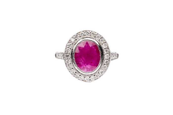 A ruby and diamond ring in 14 carat white gold