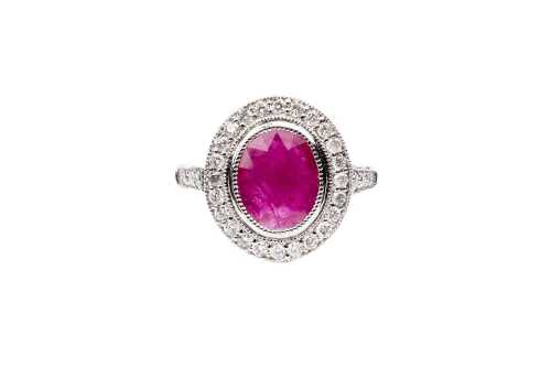 A ruby and diamond ring in 14 carat white gold