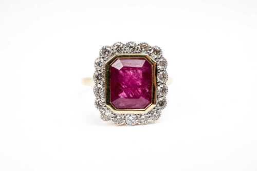 A ruby and diamond ring in 18 carat yellow gold