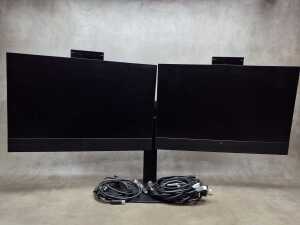 A pair of HP E24 monitors with built in pop up cameras, on stand