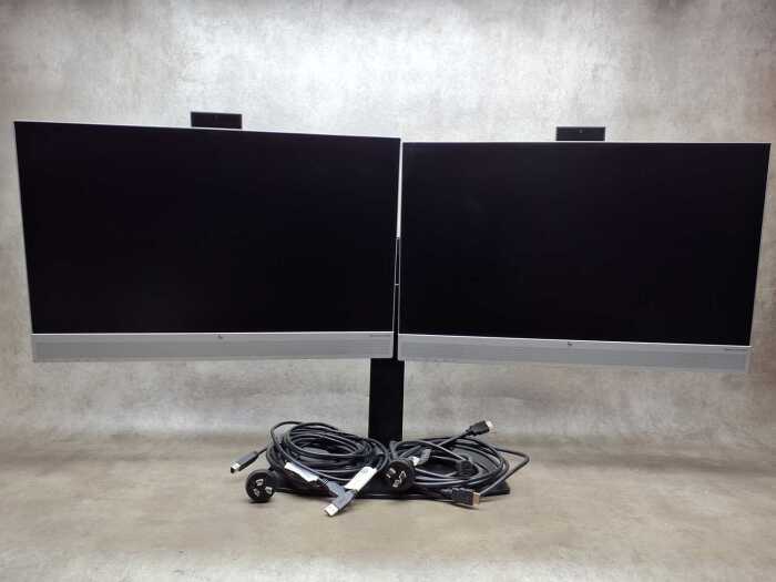 A pair of HP E24 monitors with built in pop up cameras, on stand