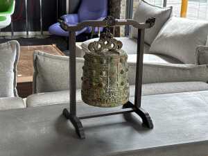 Chinese metal ritual bell mounted on timber display stand