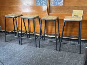 Set of four industrial-style low stools
