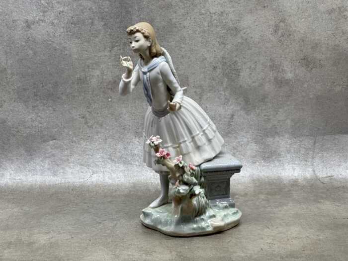 Lladro porcelain figure of a girl in a garden