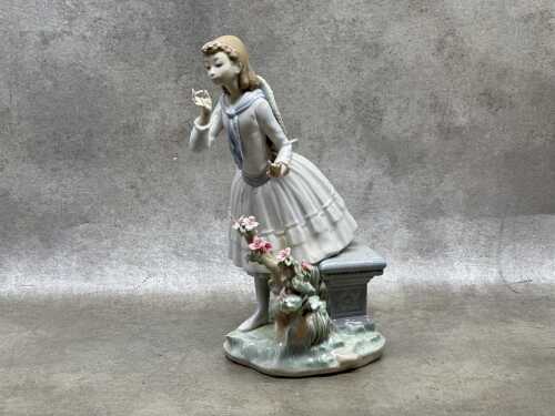 Lladro porcelain figure of a girl in a garden