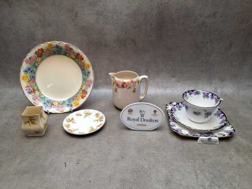 Floral design porcelain, mostly Royal Doulton, together with Royal Doulton plaque