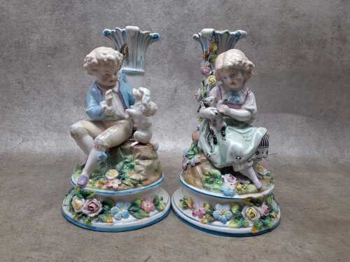 Pair of antique figural porcelain candlesticks