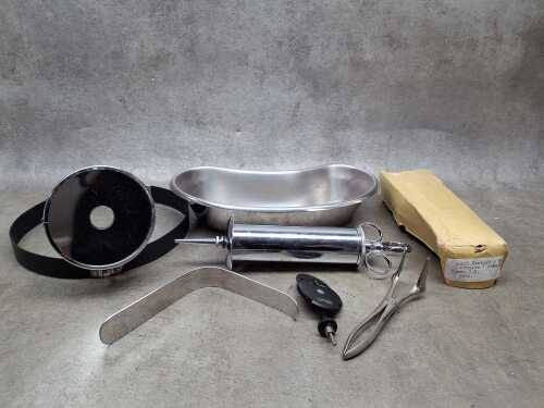 Vintage medical equipment including Aural syringe