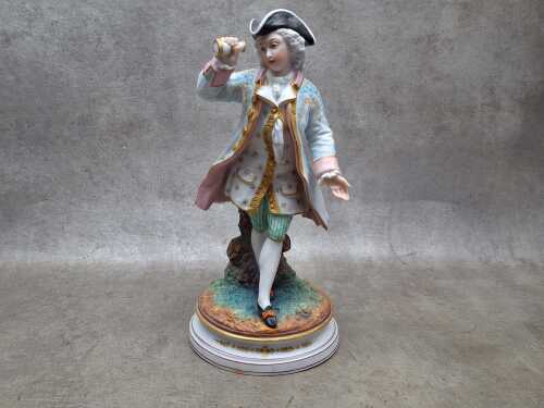 Antique porcelain figure of a man