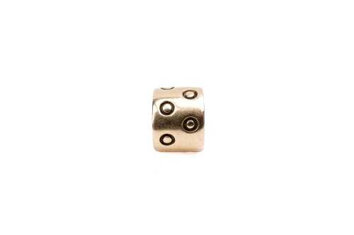 A retired Pandora seeing spots charm in 14 carat yellow gold