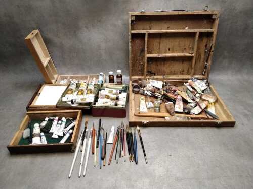 Art supplies in timber boxes, mostly oil paints and brushes