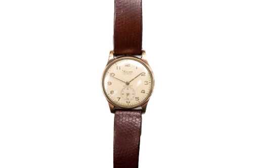 A vintage Swiss Surena watch in 9 carat yellow gold