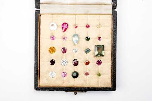 Box of natural and synthetic gemstones
