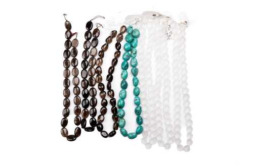 Seven unstrung quartz and turquoise beads