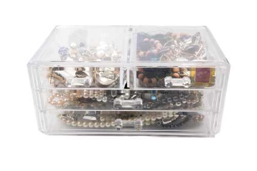 A collection of costume jewellery in a box