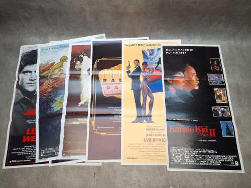 Eight movie posters, including Lethal Weapon