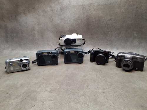 Six point and shoot digital and film cameras, mainly Kodak