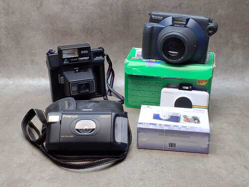 Five instant cameras including Polaroid