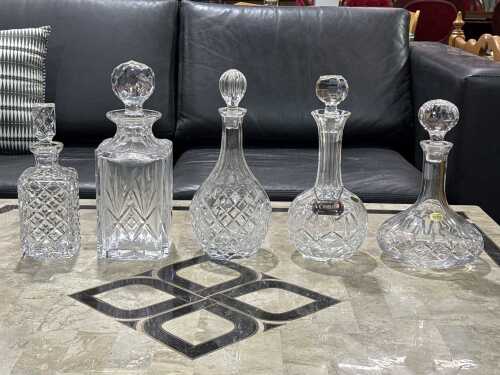 Five cut crystal decanters including Atlantis Captain's decanter