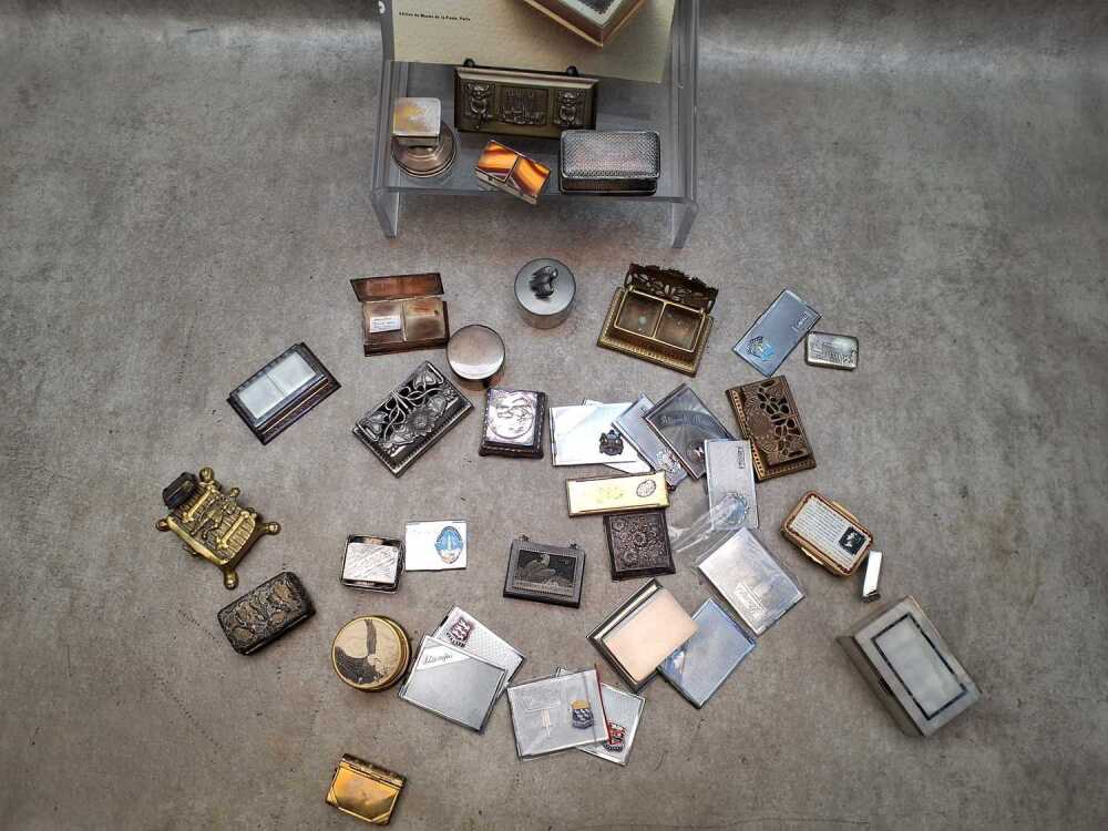 A collection of metal stamp boxes