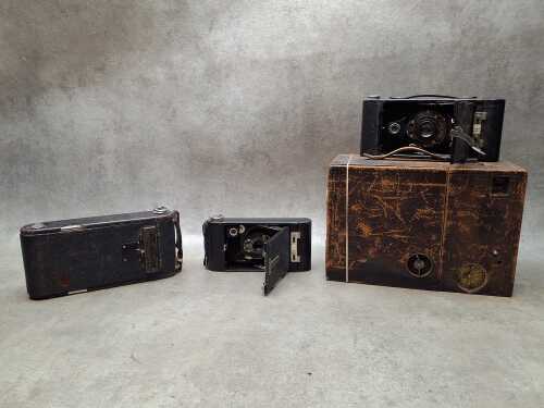 Four Kodak film cameras including Bullet Special