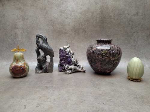 Decorative carved stone objects including amethyst and metal sculpture, onyx pear, soapstone toucan, etc