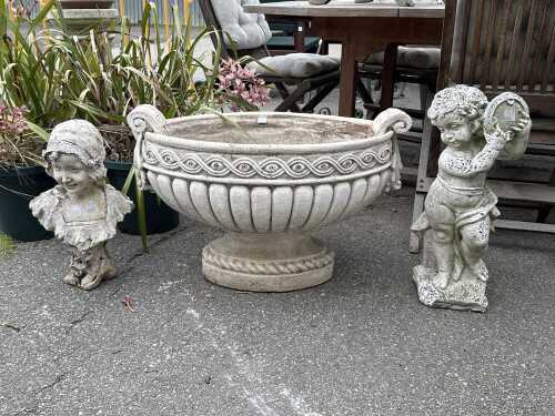 Three garden statues and planter