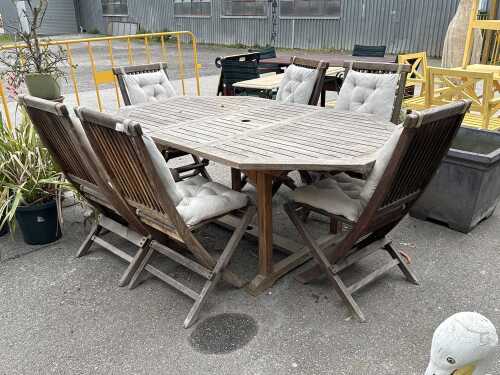 Seven-piece teak outdoor dining setting
