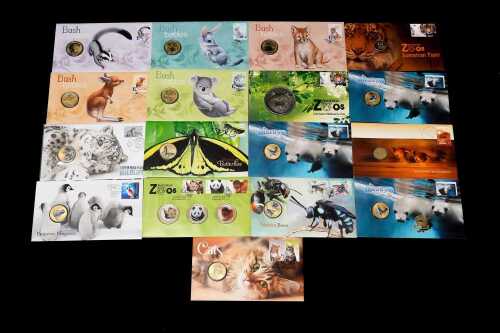Group of animal-themed collectable coins and PNCs