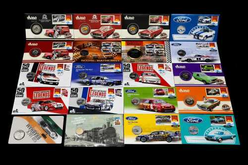 Group of motor racing-themed collectable coins and PNCs