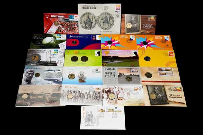A group of History & Sport themed collectable coins and PNCs