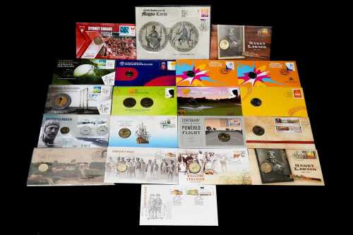 A group of History & Sport themed collectable coins and PNCs
