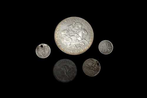 A Swan River Colony silver token plus other coins.