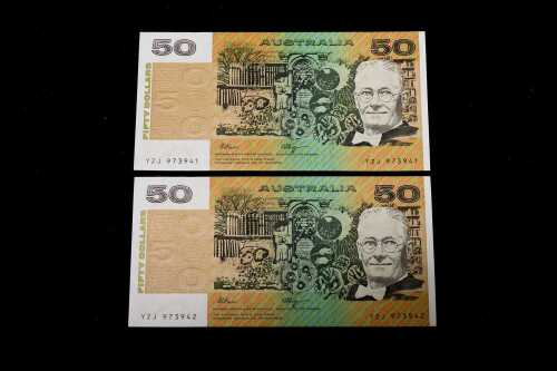 Two Australian $50 paper bank notes, consecutive serial numbers