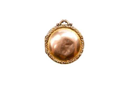 An antique locket in 9 carat rose gold