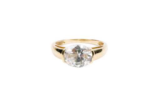 A cubic zirconia ring in 14 carat yellow gold