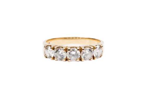 A cubic zirconia ring in 14 carat yellow gold