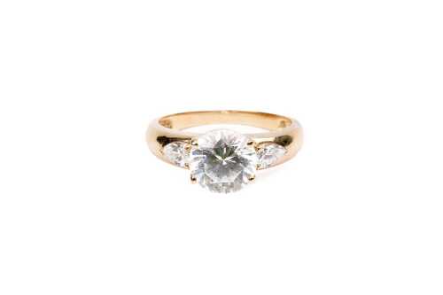 A cubic zirconia in 14 carat yellow gold