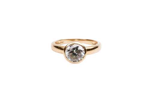 A cubic zirconia ring in 14 carat yellow gold